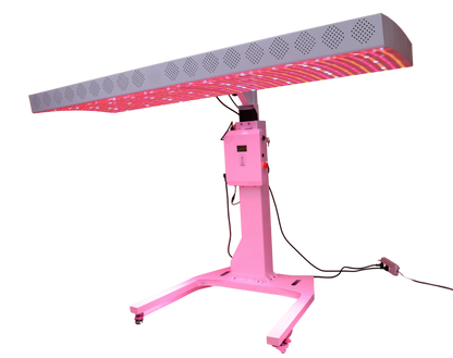 Pink LED light therapy device on a white background