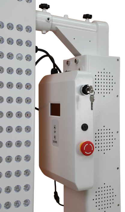 Control panel with buttons and a red start/stop button next to a light fixture.